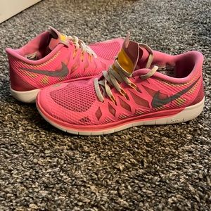 Pink and yellow Nike sneakers